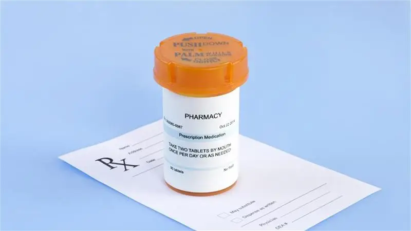 A prescription medicine bottle with a prescription form