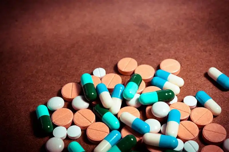 A variety of pills on a counter