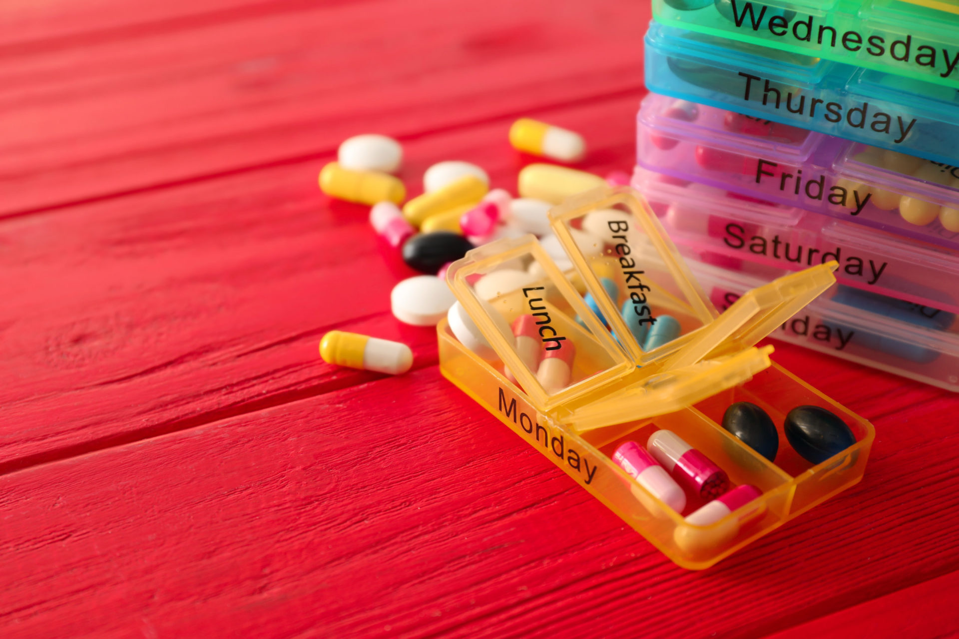 Pill containers for every day of the week containing pills