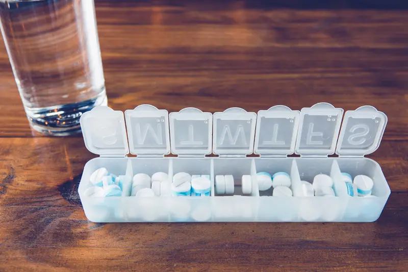 A pill organizer filled with pills