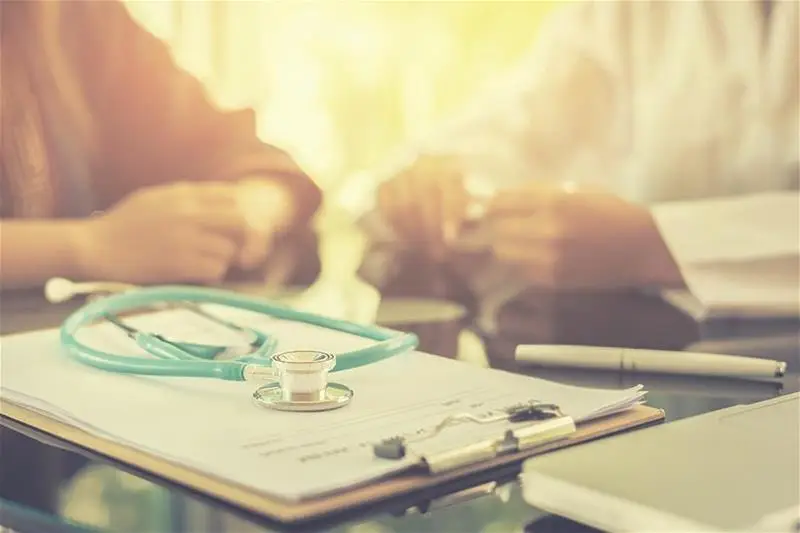 A doctor having a conversation with a patient