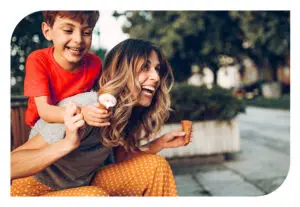 A mom and son enjoying ice cream cones