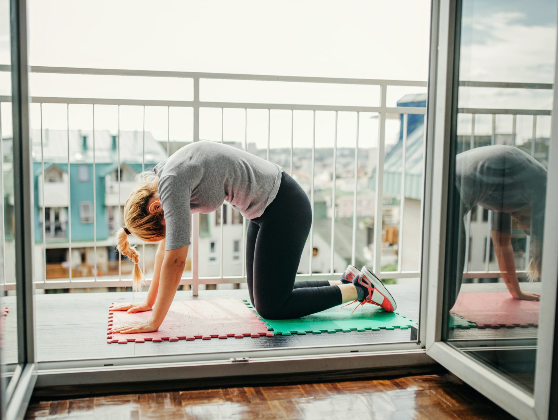Yoga_Session Woman doing yoga on her balcony in the morning