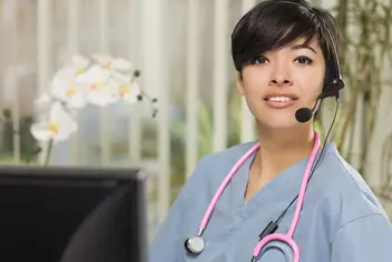 A healthcare professional talking on a headset