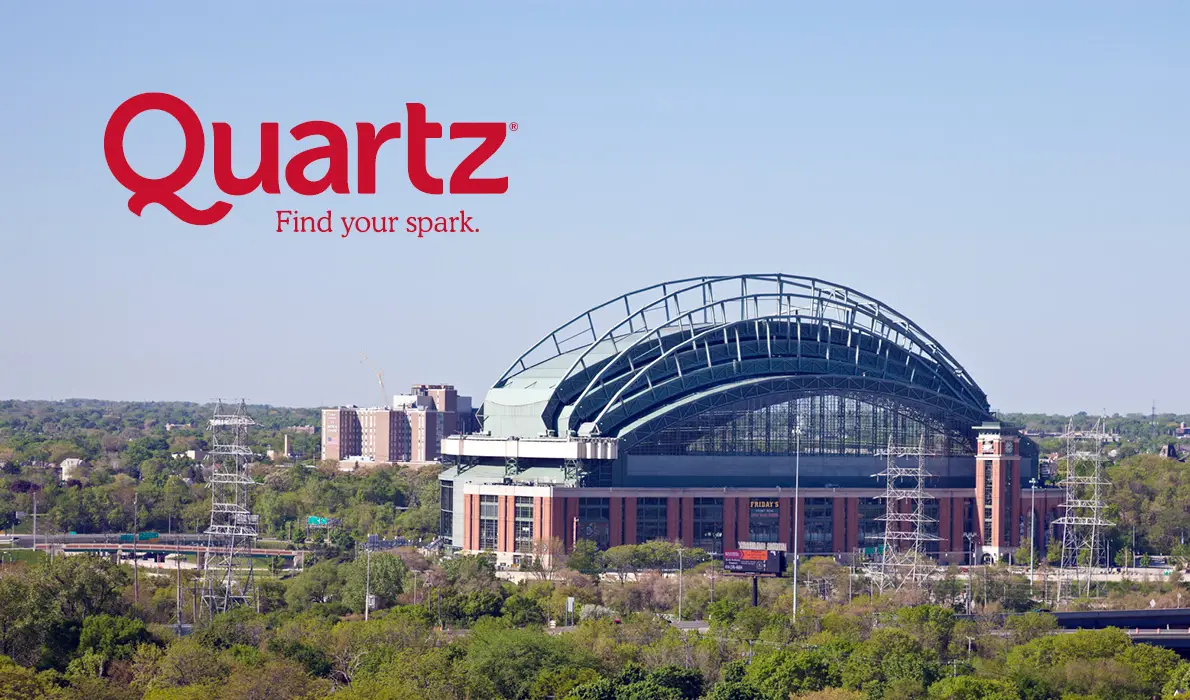 An ariel view of the Milwaukee Brewers stadium with a Quartz banner