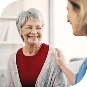 Doctor giving care to a patient in a red shirt.