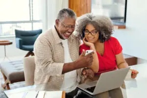 Happy senior couple looking at a smartphone