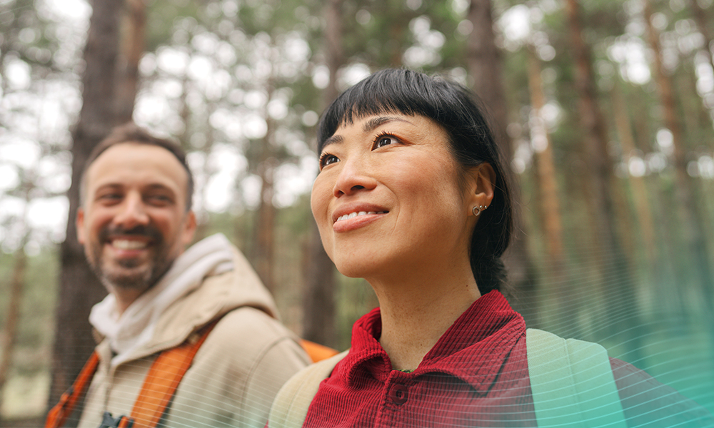 Photo of a couple exploring the woods together