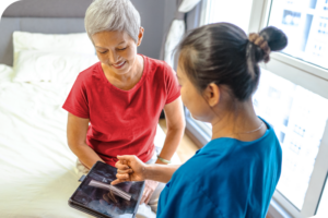 A doctor talking with a patient during a visit.