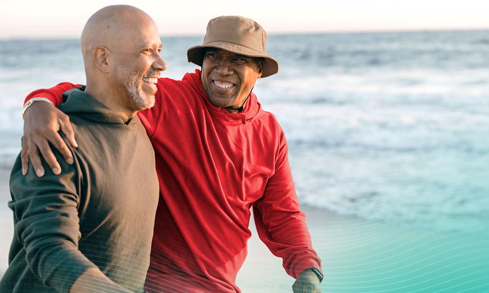 Senior couple walking on a beach together