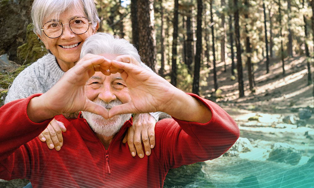 Senior couple making a heart with their hands